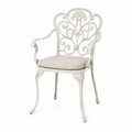 Sedia in alluminio con schienale decorato e cuscino beige